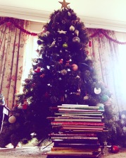 Reading Christmas Books Under the Tree